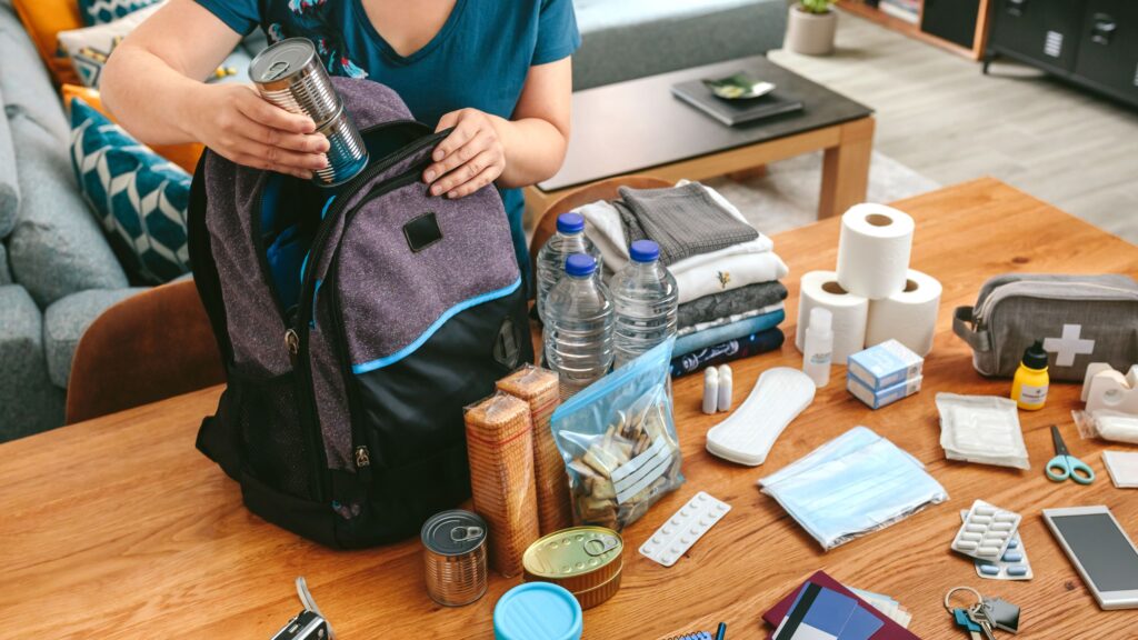 woman preparing her emergency aid kit for a trip